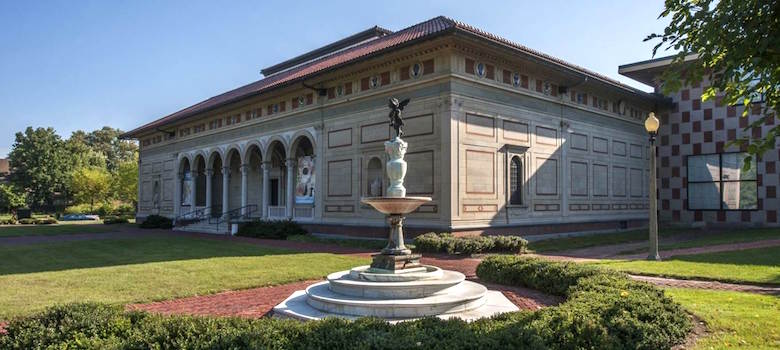 A photo of the Allen Memorial Art Museum building with a fountain in front of it