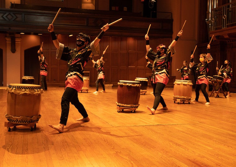 Students give a taiko drumming concert.