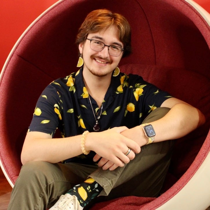 A student wearing a blue shirt with lemons.