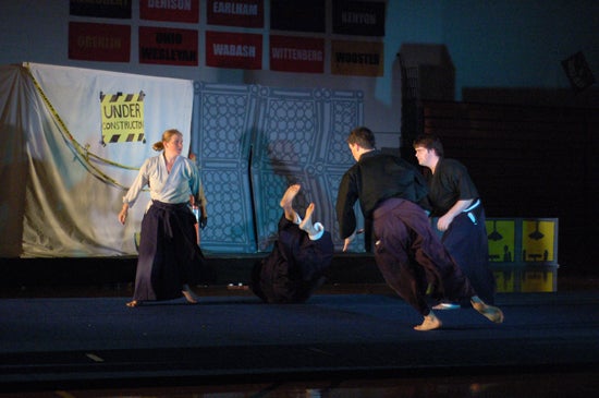 Performers doing martial arts
