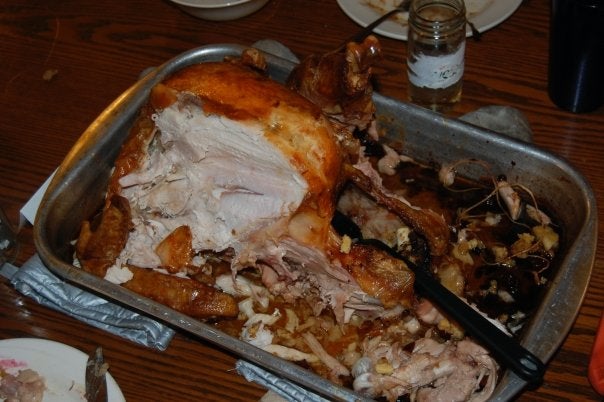 A cooked turkey partially eaten