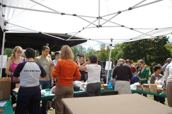 Volunteers under a tent in Tappan square
