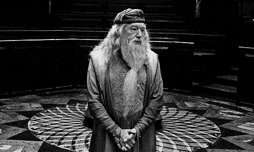 Dumbledore raises his arms apologetically. GIF.
