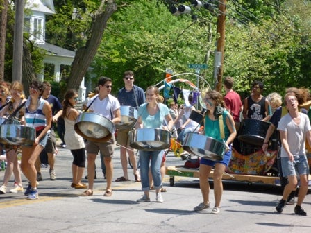 Steel drummers play while they march