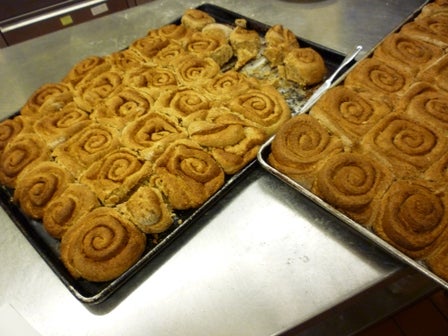 Sheet pans of baked cinnamon rolls