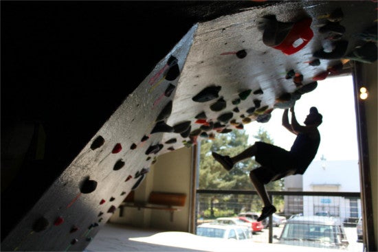 Person rock climbing on an indoor wall