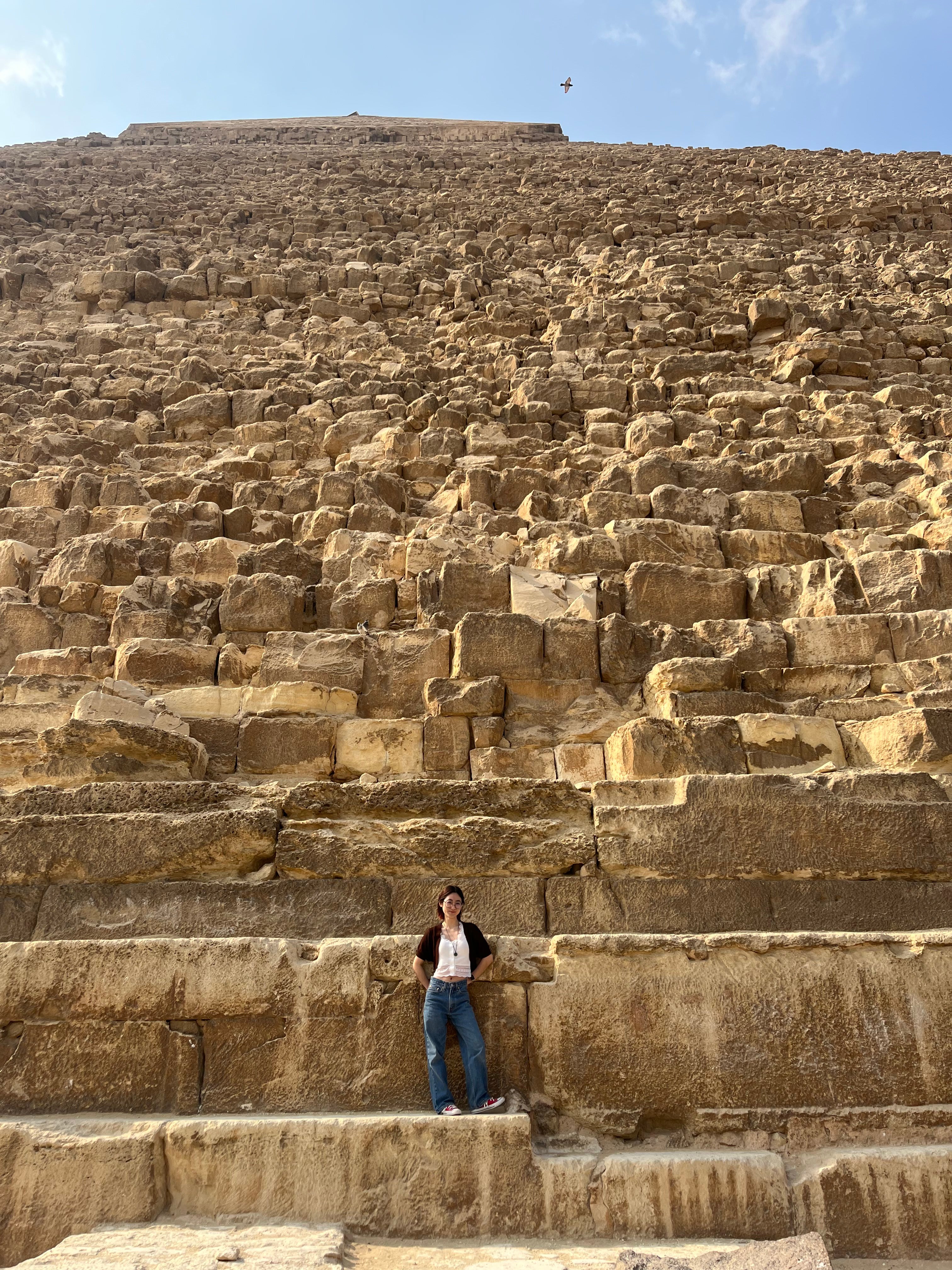 Oberlin student standing at base of the Pyramids.