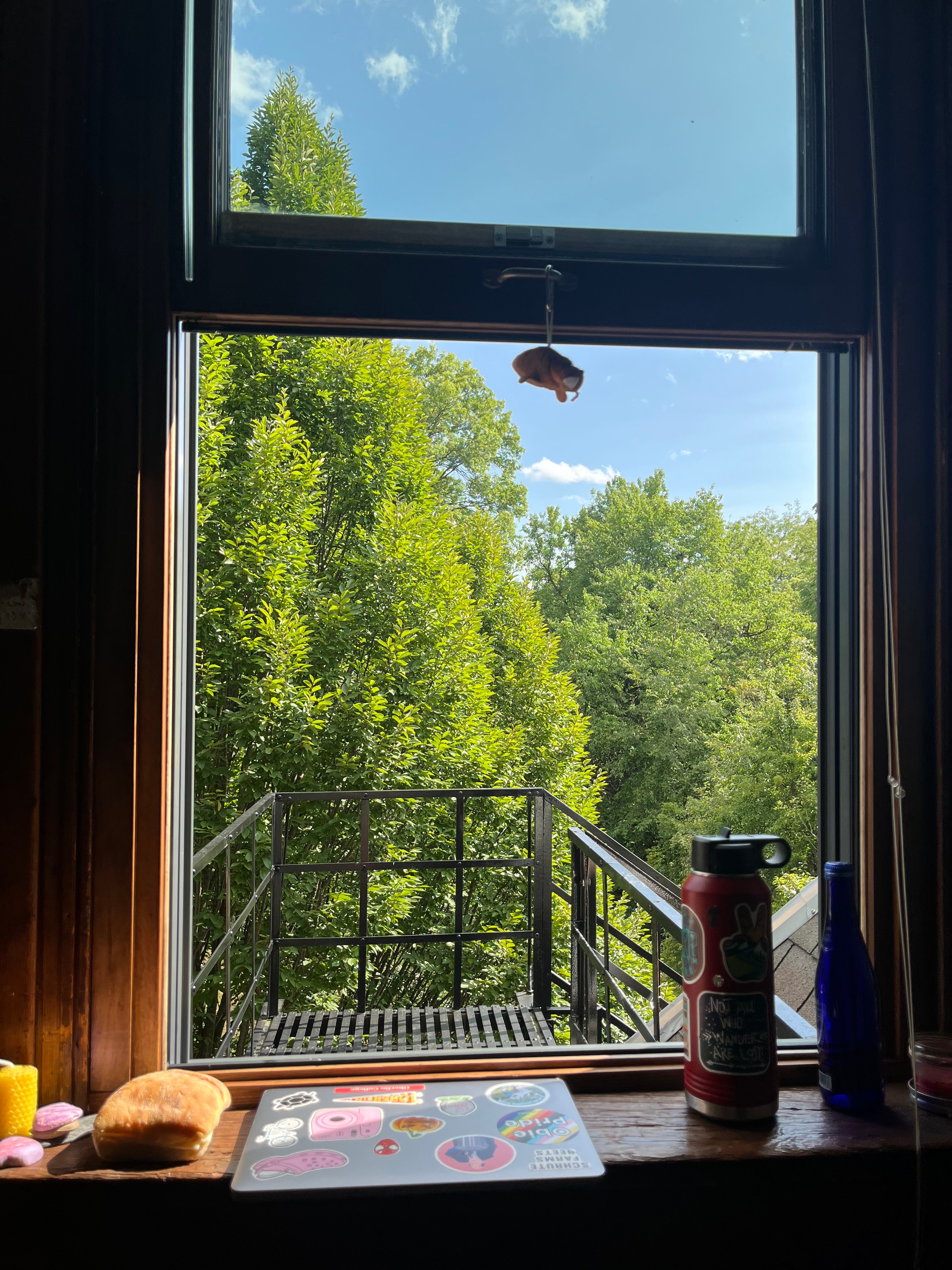 A sunny window and a folded laptop