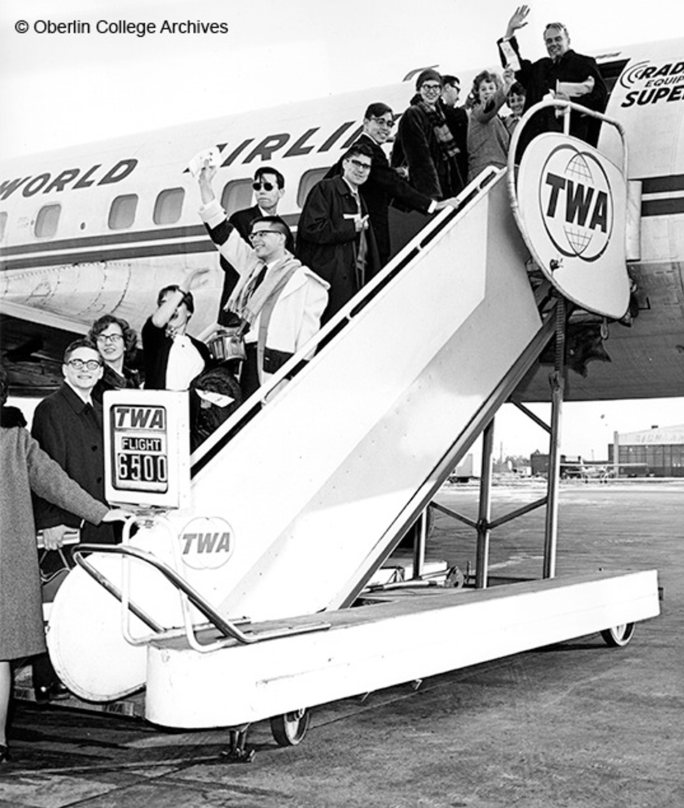 students boarding plane.