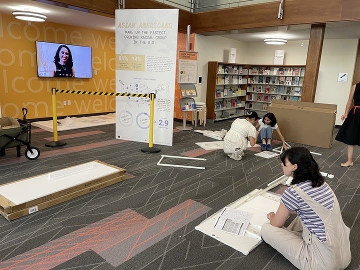 Students assemble display.