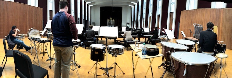 A panoramic view of the stage. Drums, xylophone, pianos, and other percussion instruments.