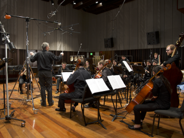 classical musicians in a studio recording session.