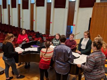 Oberlin College Student Olivia Fink leads a choir sectional in Warner Concert Hall