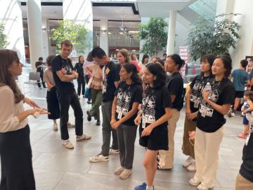 Students listen to a speaker.