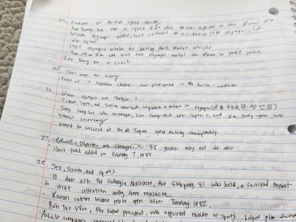 A page from Kayla's notebook is filled with handwritten notes.