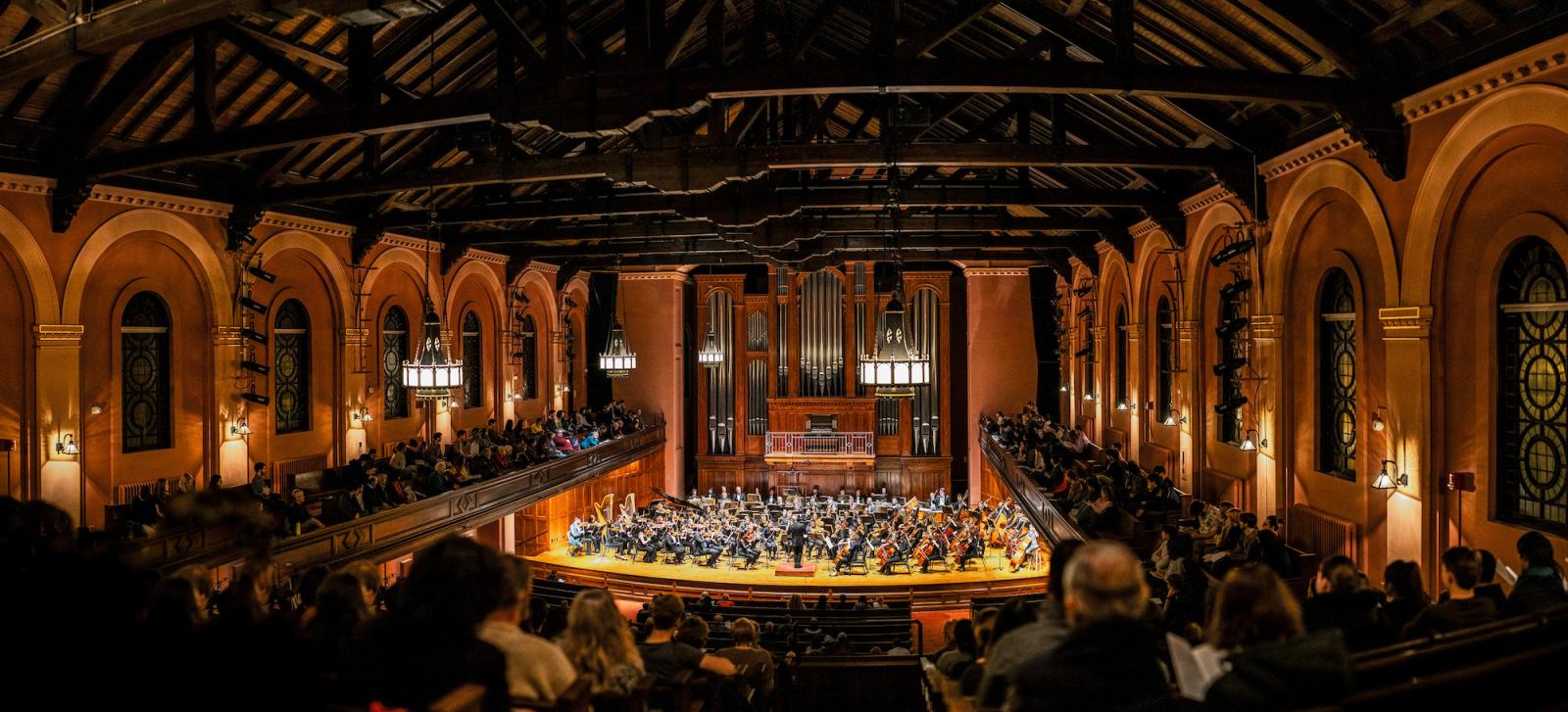 Looking down at the audience and stage from the balcony of Finney chapel.