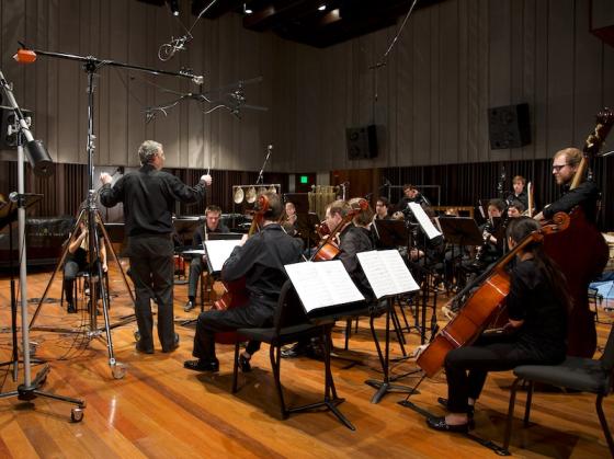 Classical musicians in a studio recording session.