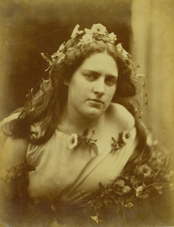 Print of a young woman, Cylene Wilson, wearing a dress with flowers on her and in her hair