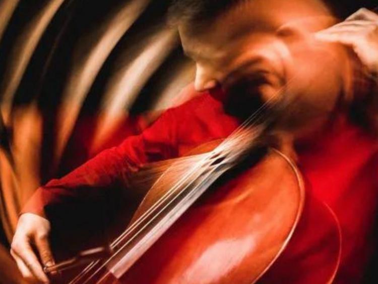 warped image of musician playing cello