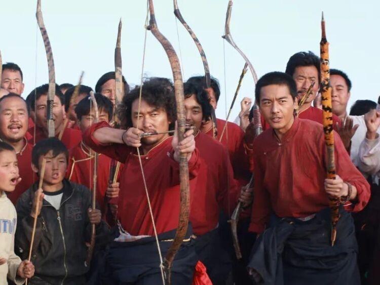 Men holding bows and arrows