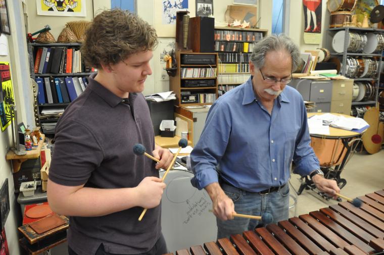 Professor Rosen and a student play marimba in the percussion studio.